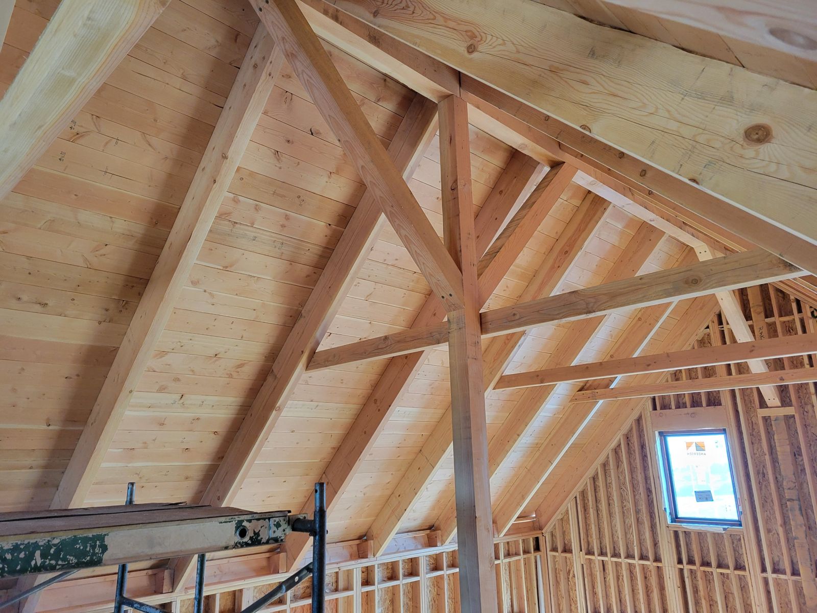 Grand Canyon Cabin interior: exposed timber king post, braces and collar ties under the vaulted wood ceiling