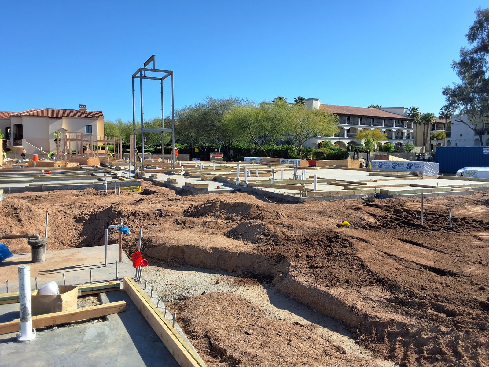 Maravilla Scottsdale early stage: slab with sill plates and steel frame, wall framing starting