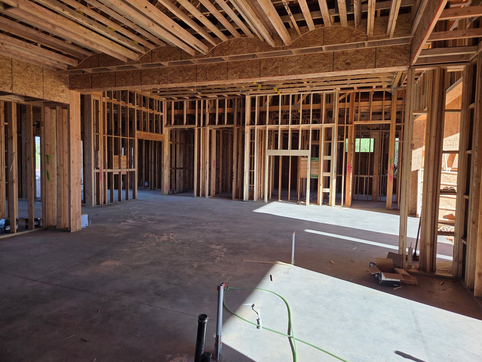 Mescal Residence interior: great room with scalloped soffit framing and open ceiling joists