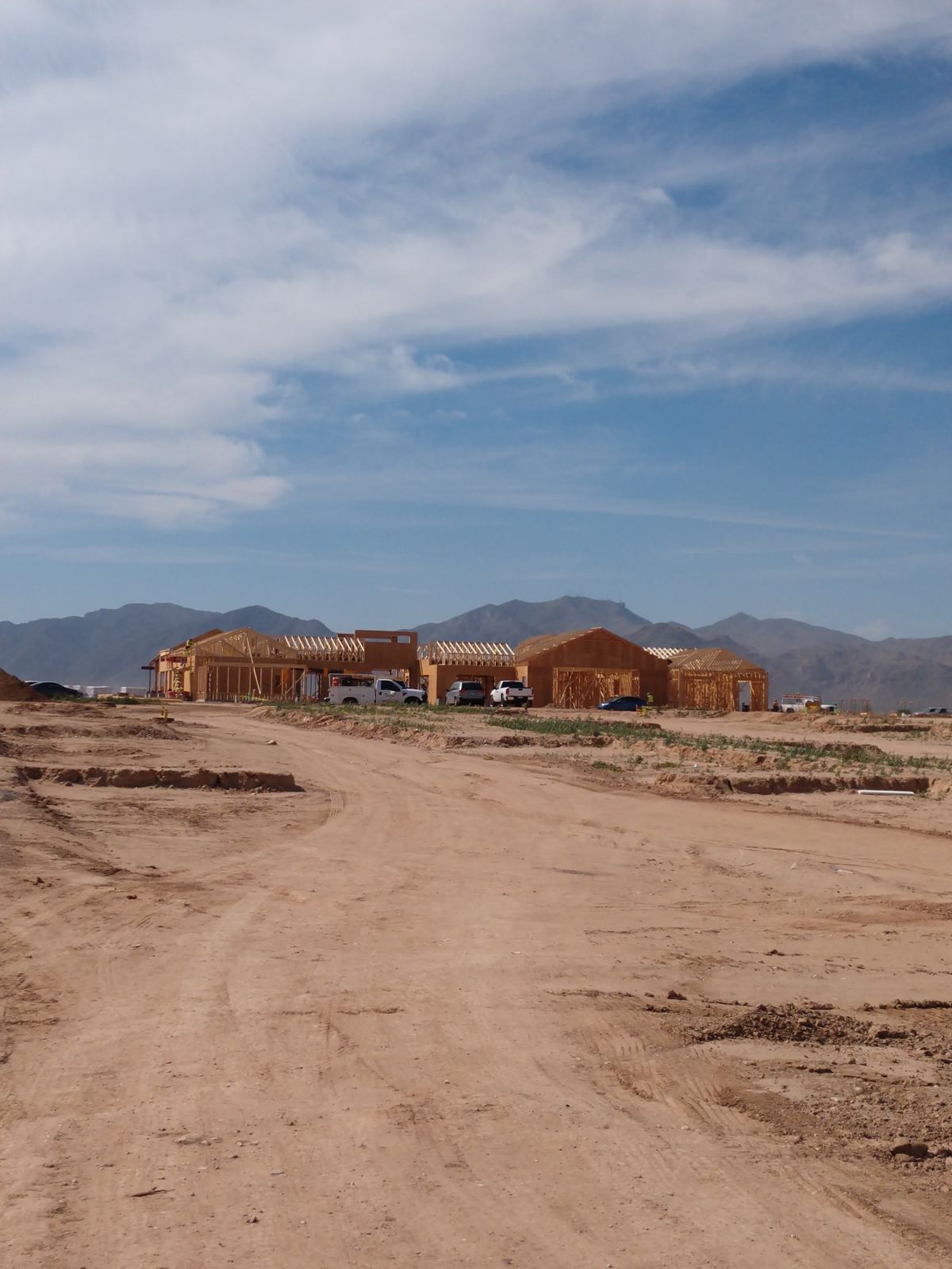 Prasada Country Club Main Building: framed clubhouse buildings with the mountains beyond